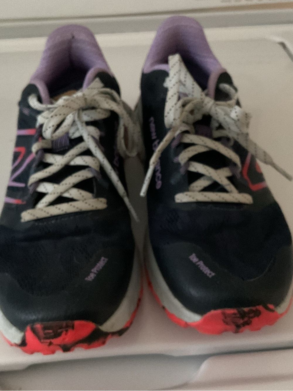 New Balance Women's Black Athletic Shoes with Purple Lining and Red Accents